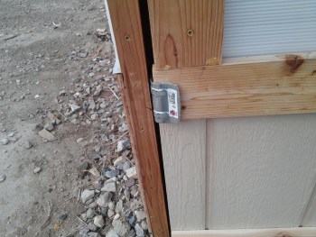 Greenhouse sliding barn door bumper