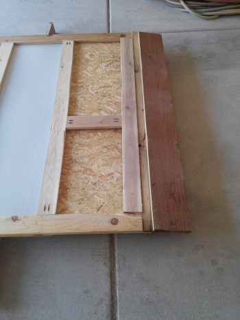 Greenhouse door - wind damaged bottom panel