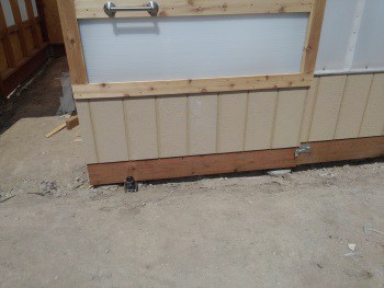 Sliding barn door stay roller and bumper in use with door open